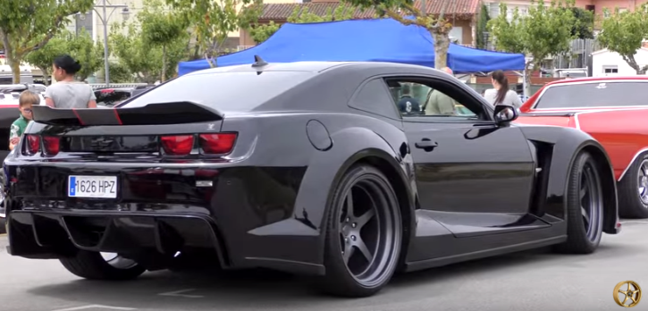 blacked out wide body chevrolet camaro. 