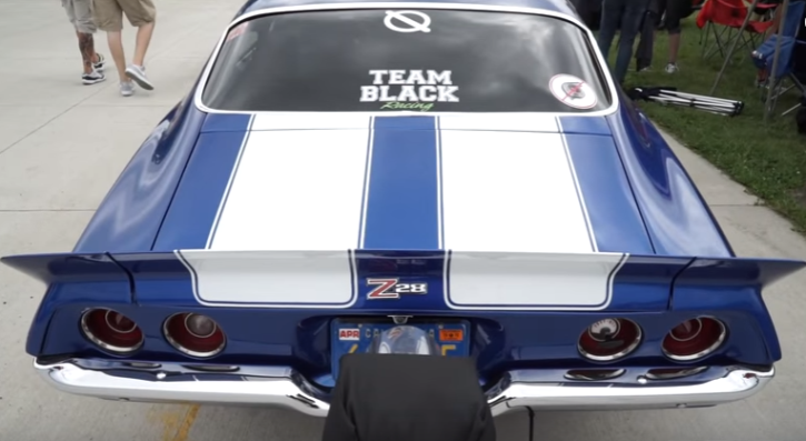 team black 1970 chevy camaro z28 drag racing