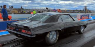 black 69 chevy camaro drag racing